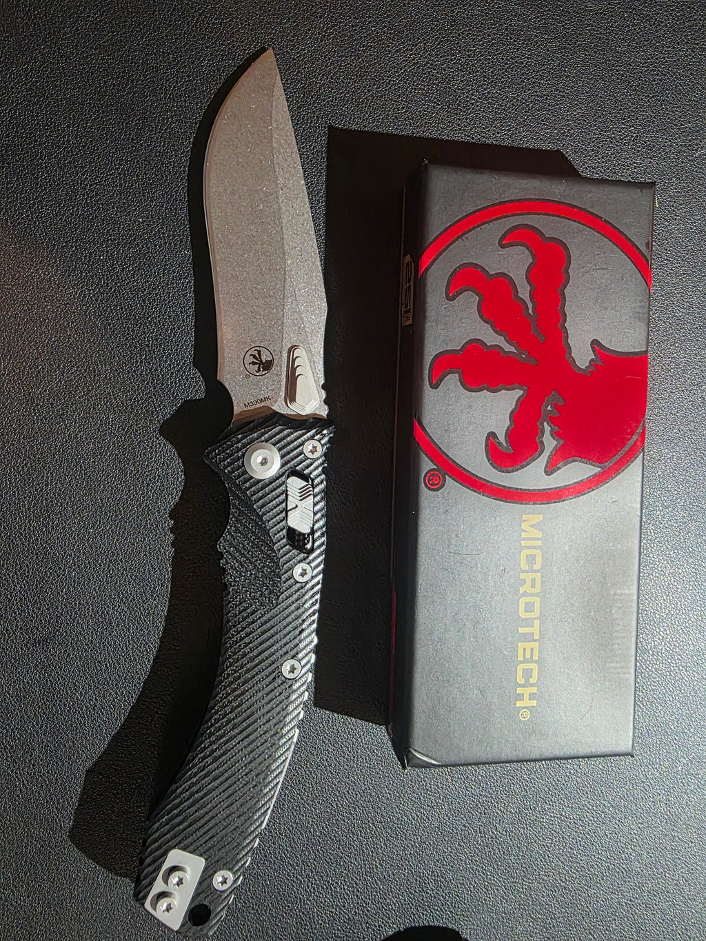 Microtech Amphibian Ram-Lok S/E Manual Knife Fluted Black G-10 (3.9" Stonewash)