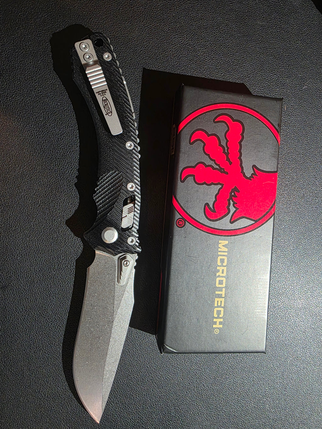 Microtech Amphibian Ram-Lok S/E Manual Knife Fluted Black G-10 (3.9" Stonewash)